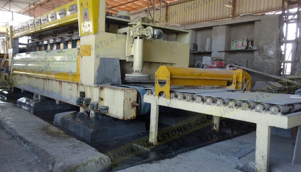 Natural stone processing and polishing machine at Indian Natural Stones manufacturing facility