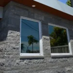 Indian Natural Stones premium basalt wall cladding with natural split-face texture installed on modern exterior façade, ideal for durable architectural wall cladding and contemporary building design.