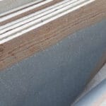 Indian Natural Stones basalt slabs with natural grey texture and rough edges, showcasing durable premium basalt stone ideal for wall cladding, flooring, and architectural applications.