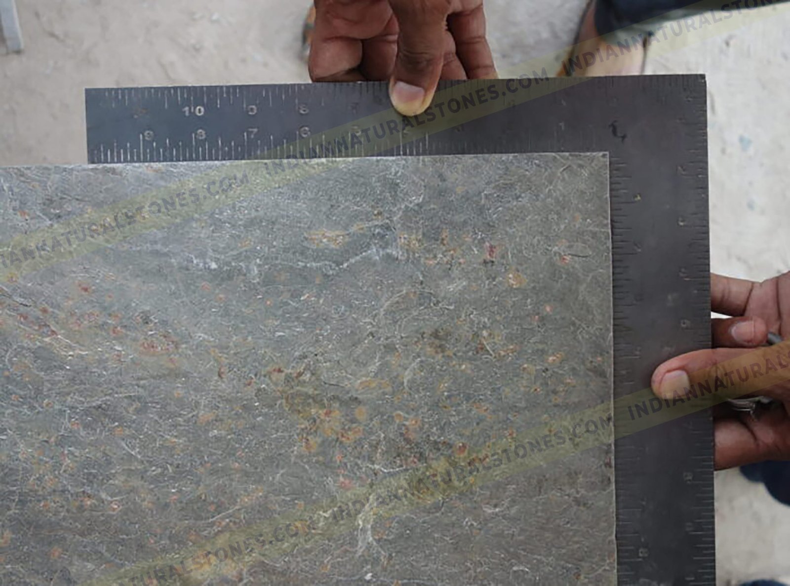 Slate-Stone-Factory-scaled-950x534x116x0x720x534x1768379044 Slate stone slab being measured for quality control and sizing at Indian Natural Stones factory