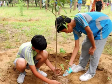 Children participating in tree plantation drive as part of environmental initiative by Indian Natural Stones