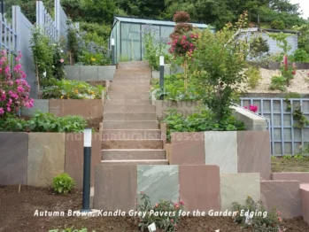 Beautiful UK garden landscaped with Indian Sandstone paving slabs in Autumn Brown and Kandla Grey, showcasing the durability and elegance of premium paving from Indian Natural Stones (INS).