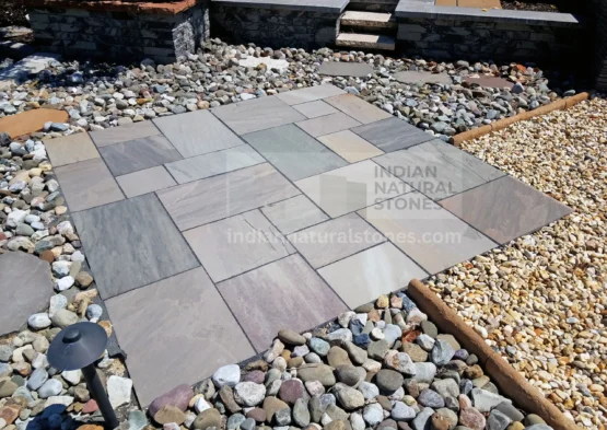 Autumn Brown Indian Sandstone patio paving installed in a contemporary outdoor landscape, showcasing natural color variation and durability by Indian Natural Stones.