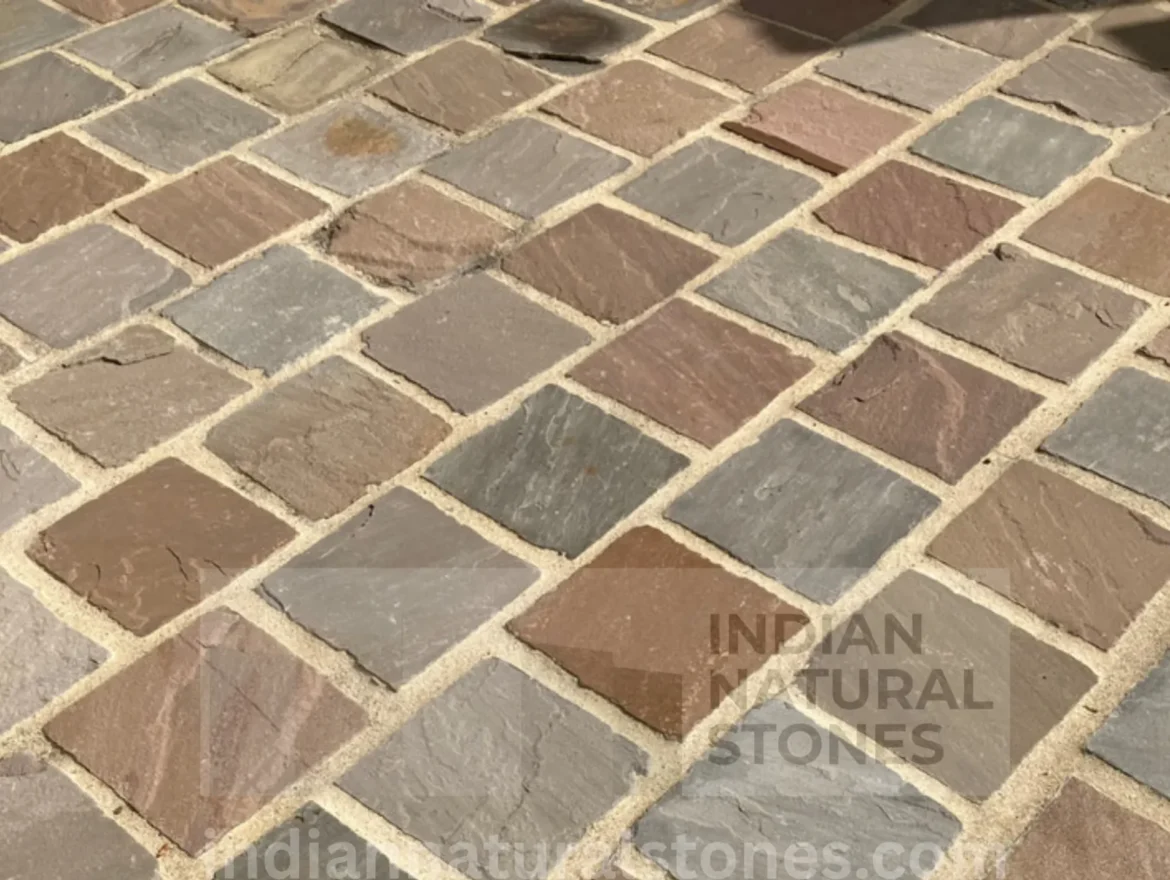 Natural Autumn Brown sandstone patio installation from Indian Natural Stones with mixed-size paving pattern and textured finish.