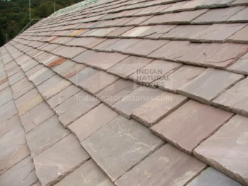 Autumn Brown Indian Sandstone roof tiles installed in overlapping pattern, showcasing natural earthy tones and durability, supplied by Indian Natural Stones.