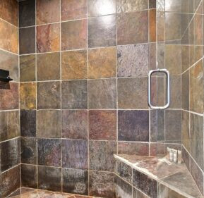 Natural stone slate tile shower walls with bench seating by Indian Natural Stones