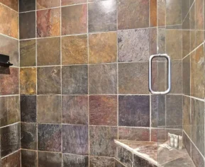 Natural stone slate tile shower walls with bench seating by Indian Natural Stones