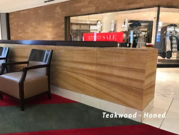 Teakwood honed Indian sandstone cladding and wall applications by Indian Natural Stones, showcasing natural wood-like textures and timeless elegance for commercial and landscape design projects.