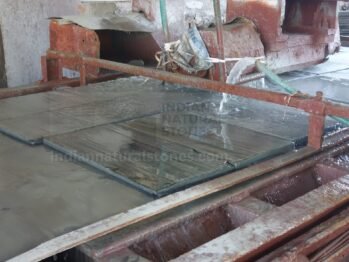 Precision natural stone tile calibration and finishing process at Indian Natural Stones manufacturing facility ensuring uniform quality and export standards