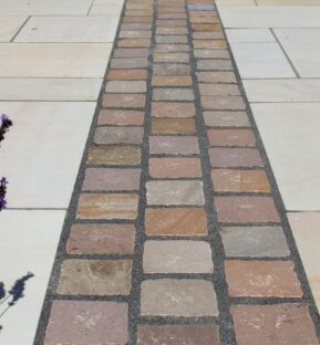 Natural stone cobblestone pathway inlay with paving slabs by Indian Natural Stones