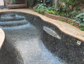 Natural stone mosaic tile swimming pool interior and curved design by Indian Natural Stones