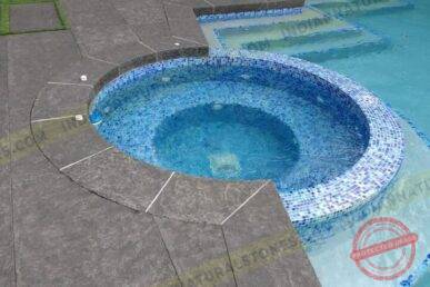 Flamed-Basalt-Pavers-726x544x4x0x720x544x1757384179-720x544x0x32x720x480x1757677357 Flamed basalt stone pool coping and circular spa surround by Indian Natural Stones