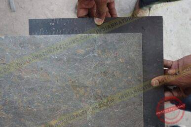 Slate-Stone-Factory-scaled Slate stone slab being measured for quality control and sizing at Indian Natural Stones factory