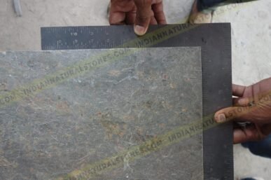 Slate stone slab being measured for quality control and sizing at Indian Natural Stones factory