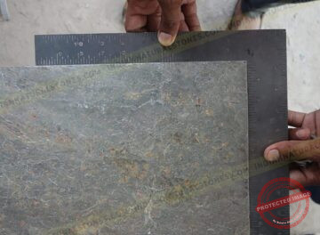 Slate stone slab being measured for quality control and sizing at Indian Natural Stones factory