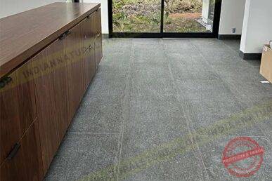 basalt Basalt stone floor tiles installed in a modern interior by Indian Natural Stone, showcasing smooth texture, dark natural finish, and durable stone flooring for residential and commercial spaces.