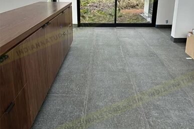 Basalt stone floor tiles installed in a modern interior by Indian Natural Stone, showcasing smooth texture, dark natural finish, and durable stone flooring for residential and commercial spaces.