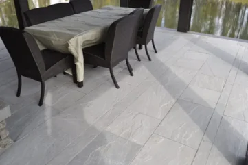 Indian Natural Stones Kandla grey sandstone paving with natural textured surface and elegant grey tones, ideal for outdoor patios, pathways, and landscaping applications.