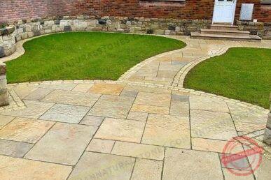 limestone Limestone paving installed in a residential garden pathway by Indian Natural Stone, showcasing smooth natural texture, warm color tones, and durable outdoor stone flooring design.
