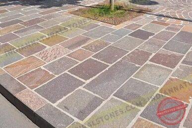 porphyry Porphyry stone paving installed for outdoor landscaping by Indian Natural Stone, showcasing multicolor natural stone tiles with durable, textured finish for walkways and public spaces.