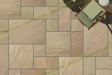 Sandstone paving tiles installed in a patio layout by Indian Natural Stone, showcasing natural color variation, textured finish, and durable outdoor stone flooring design.