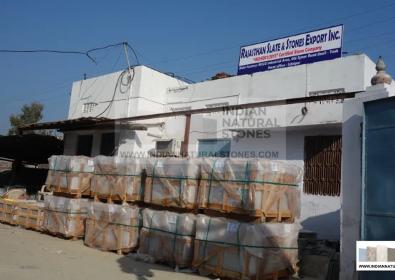 Stacked Indian slate stone pallets at supplier warehouse ready for global export