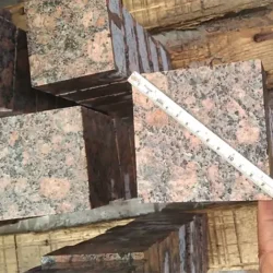 Natural Baltic red granite flamed cobblestone pavers with durable textured finish by Indian Natural Stones.