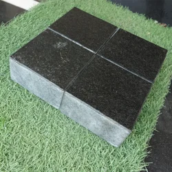 Natural black granite flamed cobblestone pavers with textured finish for outdoor use by Indian Natural Stones.