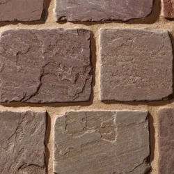 Natural chocolate sandstone cobblestone paving blocks with textured surface by Indian Natural Stones.