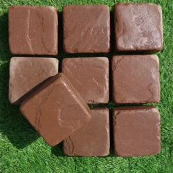 Natural Mandana red tumbled cobblestone pavers with smooth edges for outdoor flooring by Indian Natural Stones.