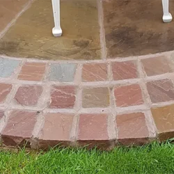 Natural sandstone cobblestone paving in circular pattern for outdoor flooring by Indian Natural Stones.