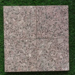 Natural red granite flamed cobblestone pavers with durable textured finish by Indian Natural Stones.