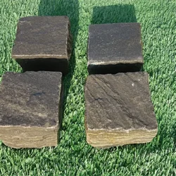 Sagar black sandstone cobblestone pavers with natural textured surface for outdoor paving by Indian Natural Stones