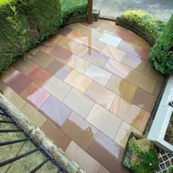 Cameo Dust sandstone natural stone paving patio with mixed size slabs by Indian Natural Stones