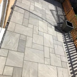 Kandla grey natural stone paving slabs installed for modern patio and outdoor flooring by Indian Natural Stones