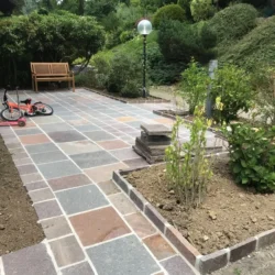 Porphyry natural stone paving slabs installed for garden pathway and outdoor landscape flooring by Indian Natural Stones