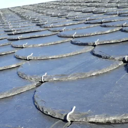 Scalloped slate roofing tiles installed in overlapping pattern by Indian Natural Stones