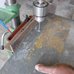 Slate roofing tile drilling process for installation by Indian Natural Stones