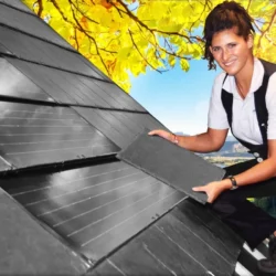 Professional installing natural slate roofing tiles on sloped roof by Indian Natural Stones