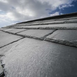Close-up of natural slate roofing tiles on sloped roof by Indian Natural Stones
