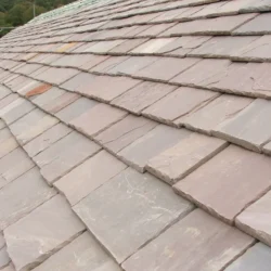 Natural slate roofing tile installation on pitched roof by Indian Natural Stones