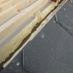 Close-up of natural slate roofing tiles installation on wooden roof frame by Indian Natural Stones