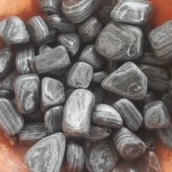 Tricorn Black Pebbles from Indian Natural Stones for architectural landscaping use.