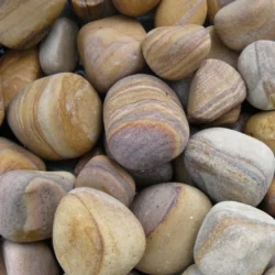 Rainbow Sandstone pebbles showcasing soft sandstone texture by Indian Natural Stones