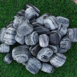 Tiger Black Marble Pebbles supplied by Indian Natural Stones for landscaping projects