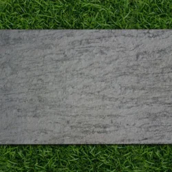 Flexible stone veneer sheet in Fantasy white finish placed on grass by Indian Natural Stones