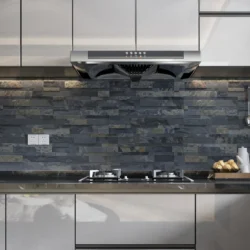 3D peel and stick stone panels by Indian Natural Stones in Black Rustic finish, installed as a modern kitchen backsplash with natural textured stone for stylish and easy wall cladding.