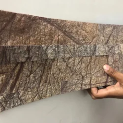 Flexible Rainforest Brown 3D peel and stick stone panel being installed on wall by Indian Natural Stones